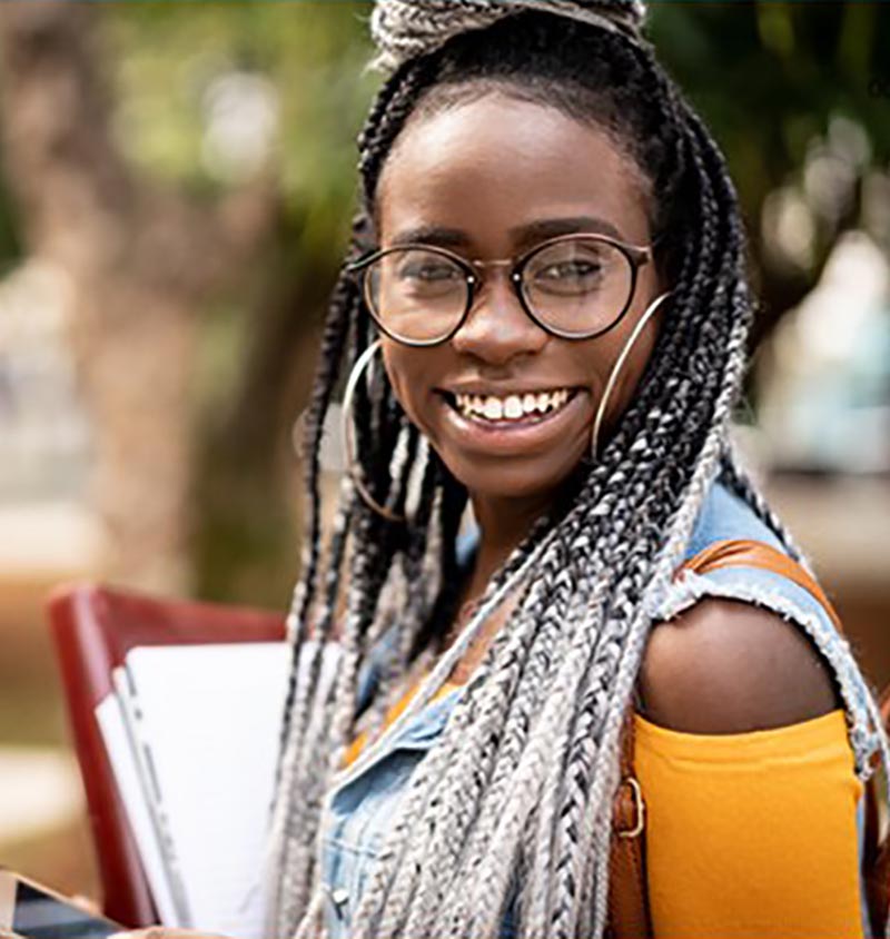 Black student carrying books